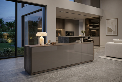 Double-height contemporary home at dusk with a statement stone kitchen