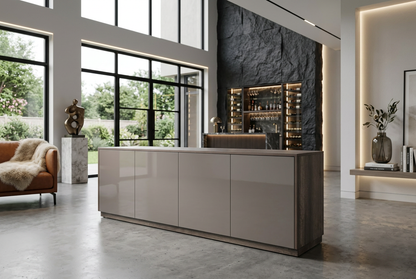 Double-height home with charcoal stone bar and cognac accents