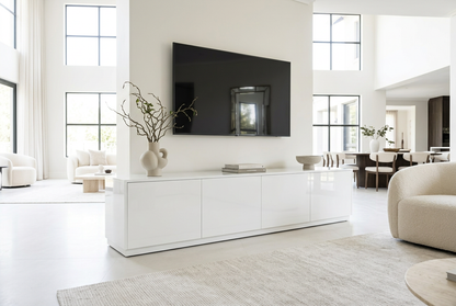 BLOCK gloss white TV unit in a bright luxury open-plan living and dining room