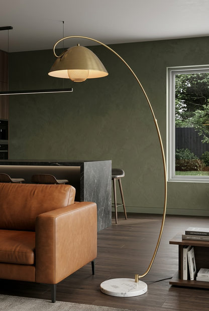 Aurelia brass-finish arc lamp in a deep olive interior