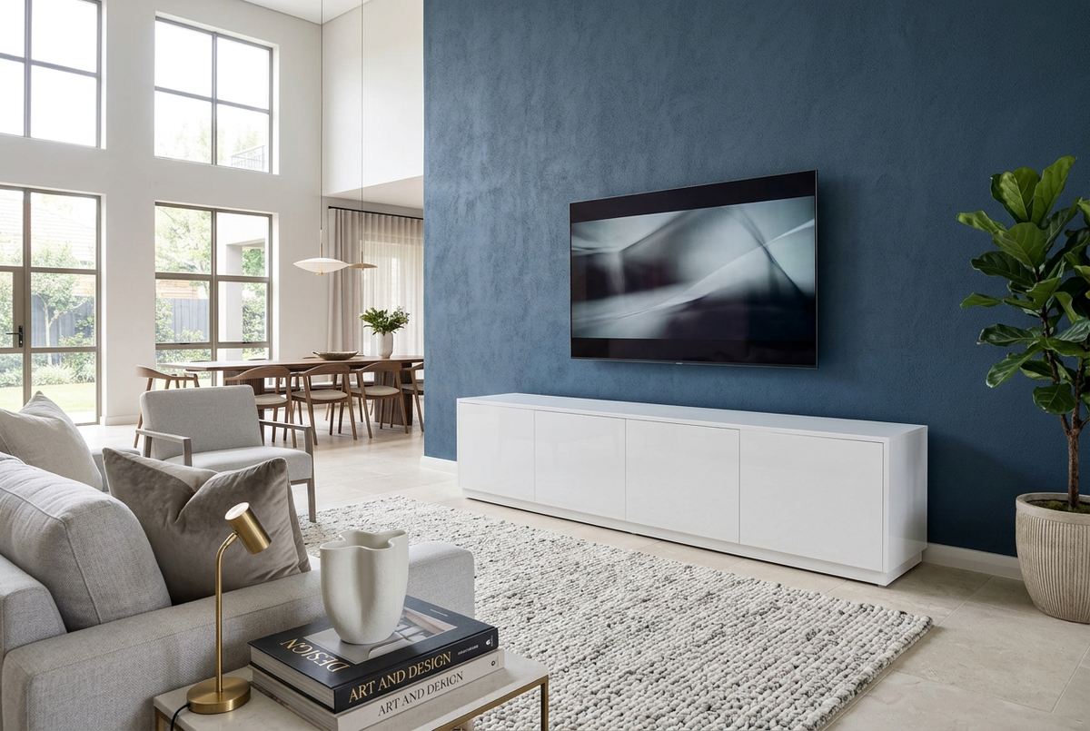 BLOCK gloss white TV unit beneath a television against a deep blue feature wall