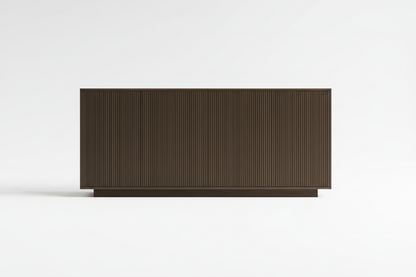 A modern rectangular sideboard or credenza with a dark brown fluted or ribbed front panel and a matching base, shown against a clean white studio background.