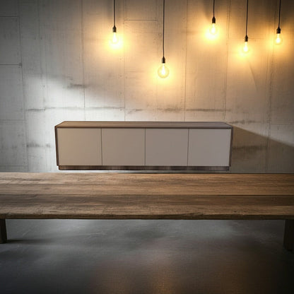 TRENZY Spaces Lux Congo-Oak TV stand with a sleek modern design, mounted above a rustic wooden table in a loft space.