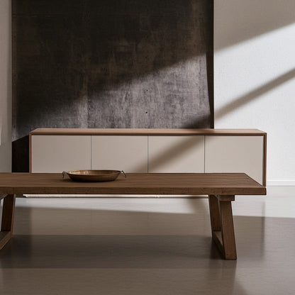 TRENZY Spaces Lux Congo-Oak TV stand with a sleek, minimalist design and neutral cabinet doors in a modern living room.