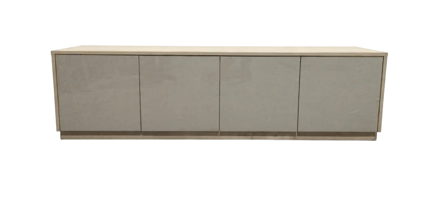 TRENZY Spaces Lux TV stand in a modern minimalist design with a light wood frame and four sleek grey cabinet doors.