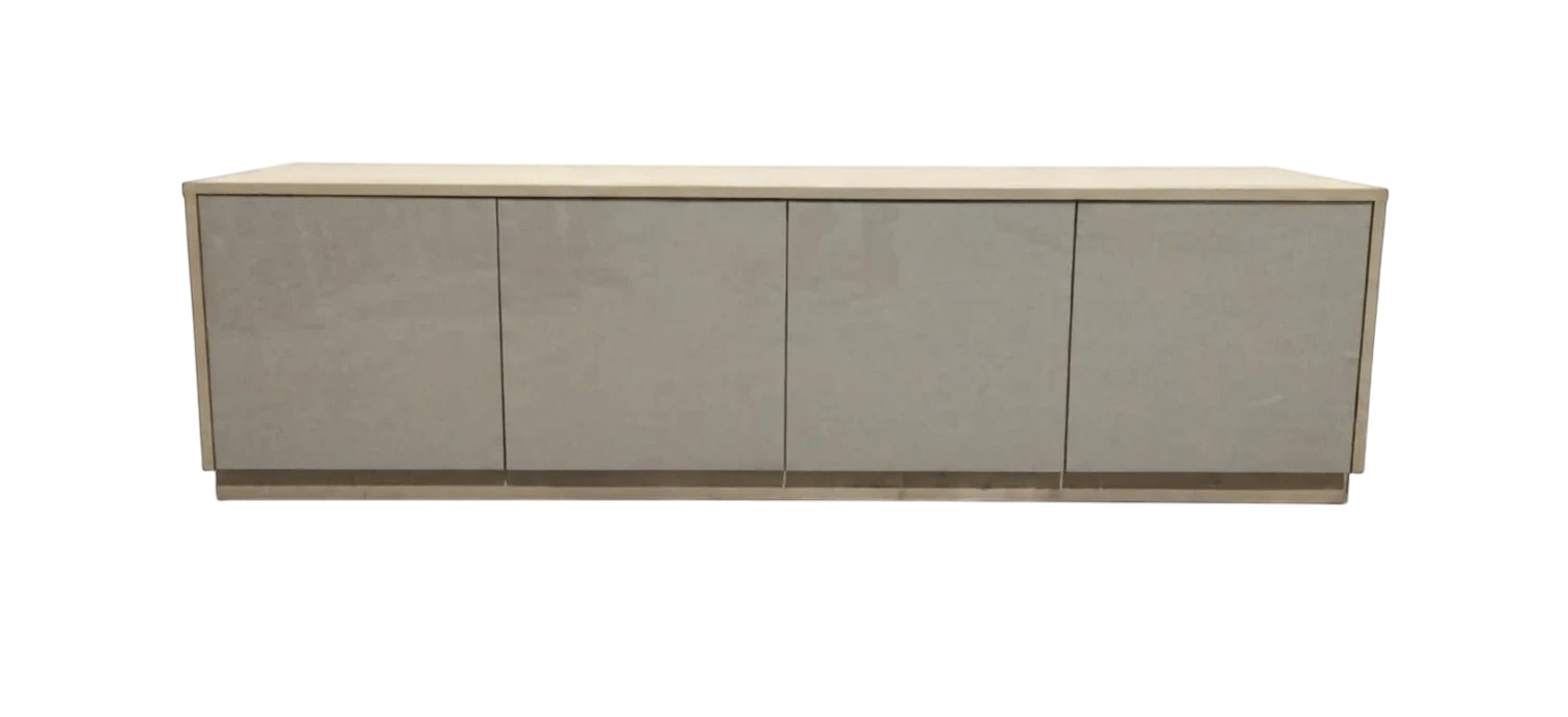 TRENZY Spaces Lux TV stand in a modern minimalist design with a light wood frame and four sleek grey cabinet doors.