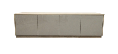 TRENZY Spaces Lux TV stand in a modern minimalist design with a light wood frame and four sleek grey cabinet doors.