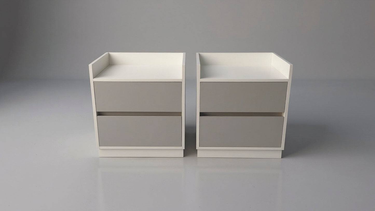 TRENZY Spaces modern luxury bedside pedestal pair with two drawers, featuring a white frame and grey drawer fronts.